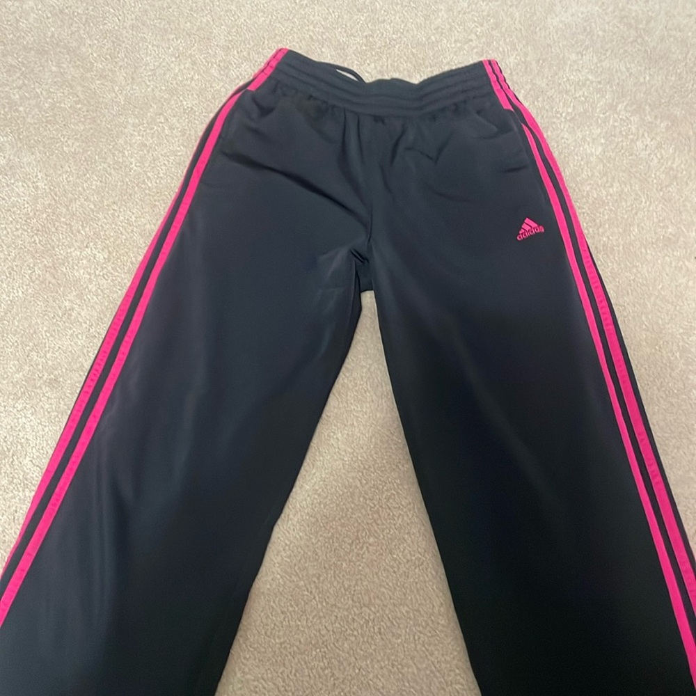 Black adidas track pants.